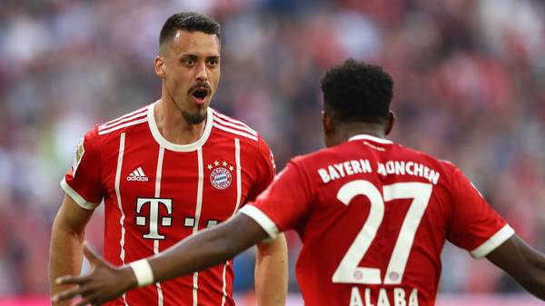 MUNICH, GERMANY - APRIL 14: Sandro Wagner of Muenchen (l) celebrates with David Alaba of Bayern Muenchen after he scored a goal to make it 2:1 during the Bundesliga match between FC Bayern Muenchen and Borussia Moenchengladbach at Allianz Arena on April 14, 2018 in Munich, Germany. (Photo by Martin Rose/Bongarts/Getty Images)