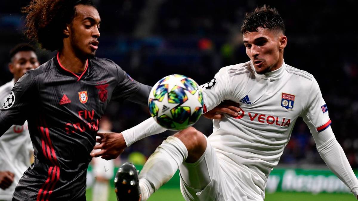 Benfica's  Portuguese defender Thomas Tavares (L) is challenged by Lyon's French midfielder Houssem Aouar during the UEFA Champions League Group G football match between Olympique Lyonnais and SL Benfica at the Decines Groupama Stadium, on November 5, 2019. (Photo by JEFF PACHOUD / AFP) (Photo by JEFF PACHOUD/AFP via Getty Images)