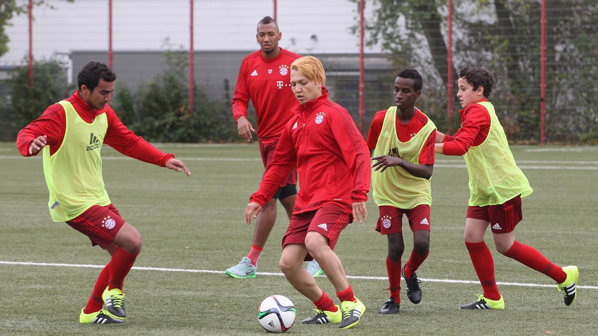 FC Bayern Muenchen Opens Training Session For Refugees