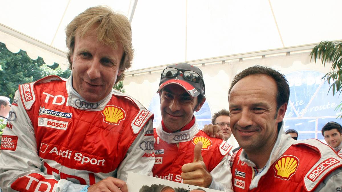 Le Mans's 2007's winners German driver F Franck Biela (l.), Emanuel Piro (ITA/M.) und Marco Werner (Deutschland/r.) feiern ihren Le Mans-Triumph 2007