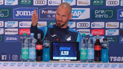 Christian Ilzer spricht vor dem Spiel gegen den VfB Stuttgart über die Champions-League-Ambitionen der TSG Hoffenheim. Der Österreicher bemüht dabei Vergleiche, für die er im Anschluss als "Gott der Metaphern" bezeichnet wird.