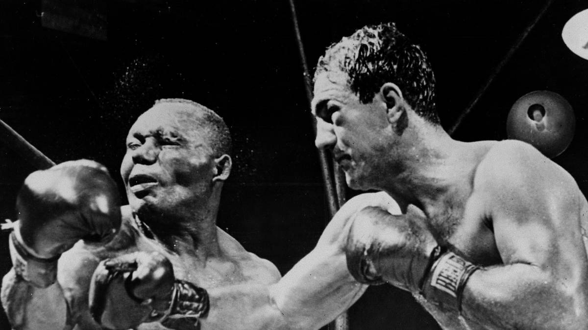 Kein einziger Zeitgenosse fand ein Mittel gegen Marcianos wild-energetischen Stil. Jersey Joe Walcott (im Bild) fiel ihm ebenso zum Opfer wie Joe Louis, Ezzard Charles und Archie Moore. Weltmeister wurde Marciano aber erst recht spät, drei Jahre vor seinem Karriereende