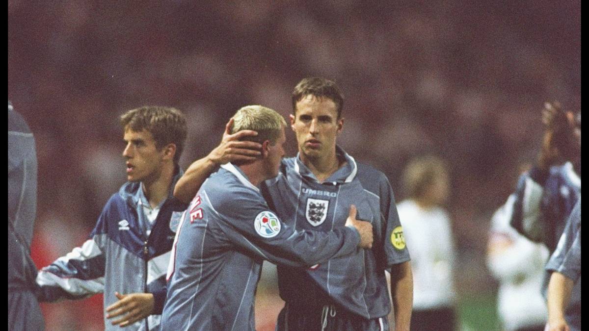 Paul Gascoigne and teammate Gareth Southgate of England show the agony of defeat