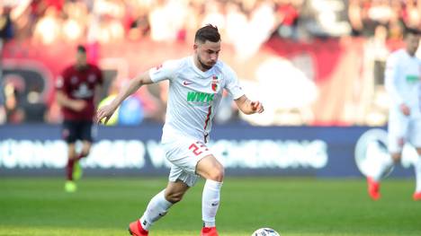 NUREMBERG, GERMANY - MARCH 30: Marco Richter of Augsburg runs with the ball during the Bundesliga match between 1. FC Nuernberg and FC Augsburg at Max-Morlock-Stadion on March 30, 2019 in Nuremberg, Germany. (Photo by Alexander Hassenstein/Bongarts/Getty Images)