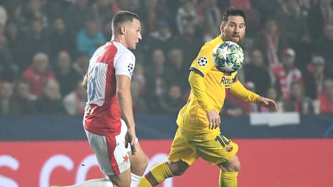 Slavia's Czech defender Jan Boril (L) and Barcelona's Argentinian forward Lionel Messi vie for the ball during the UEFA Champions League football match between SK Slavia Prague and FC Barcelona in Prague, Czech Republic on October 23, 2019. (Photo by JOE KLAMAR / AFP) (Photo by JOE KLAMAR/AFP via Getty Images)