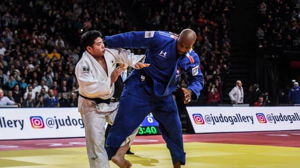 France's Teddy Riner (R) fights against Japan's Kokoro Kageura during the over 100 kg category men's third round fight at the Judo Paris Grand Slam 2020, in Paris, France. (Photo by Lucas Barioulet / AFP) (Photo by LUCAS BARIOULET/AFP via Getty Images)