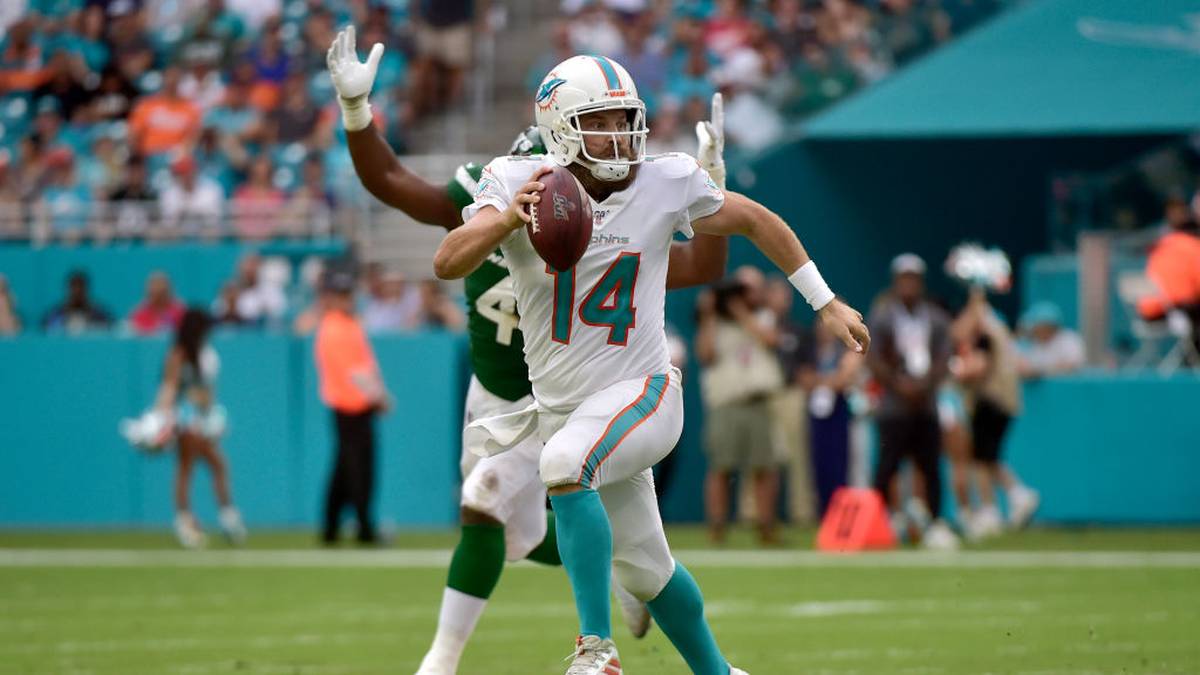 MIAMI, FL - NOVEMBER 03: Ryan Fitzpatrick #14 of the Miami Dolphins scrambles out of the pocket during the second quarter against the New York Jets at Hard Rock Stadium on November 3, 2019 in Miami, Florida. (Photo by Eric Espada/Getty Images)