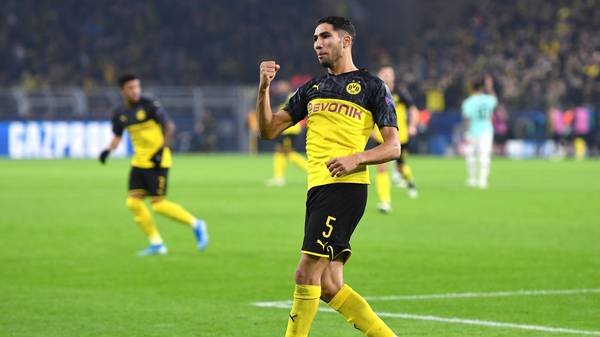 DORTMUND, GERMANY - NOVEMBER 05: Achraf Hakimi of Borussia Dortmund celebrates after scoring his team's first goal during the UEFA Champions League group F match between Borussia Dortmund and Inter at Signal Iduna Park on November 05, 2019 in Dortmund, Germany. (Photo by Jörg Schüler/Getty Images)