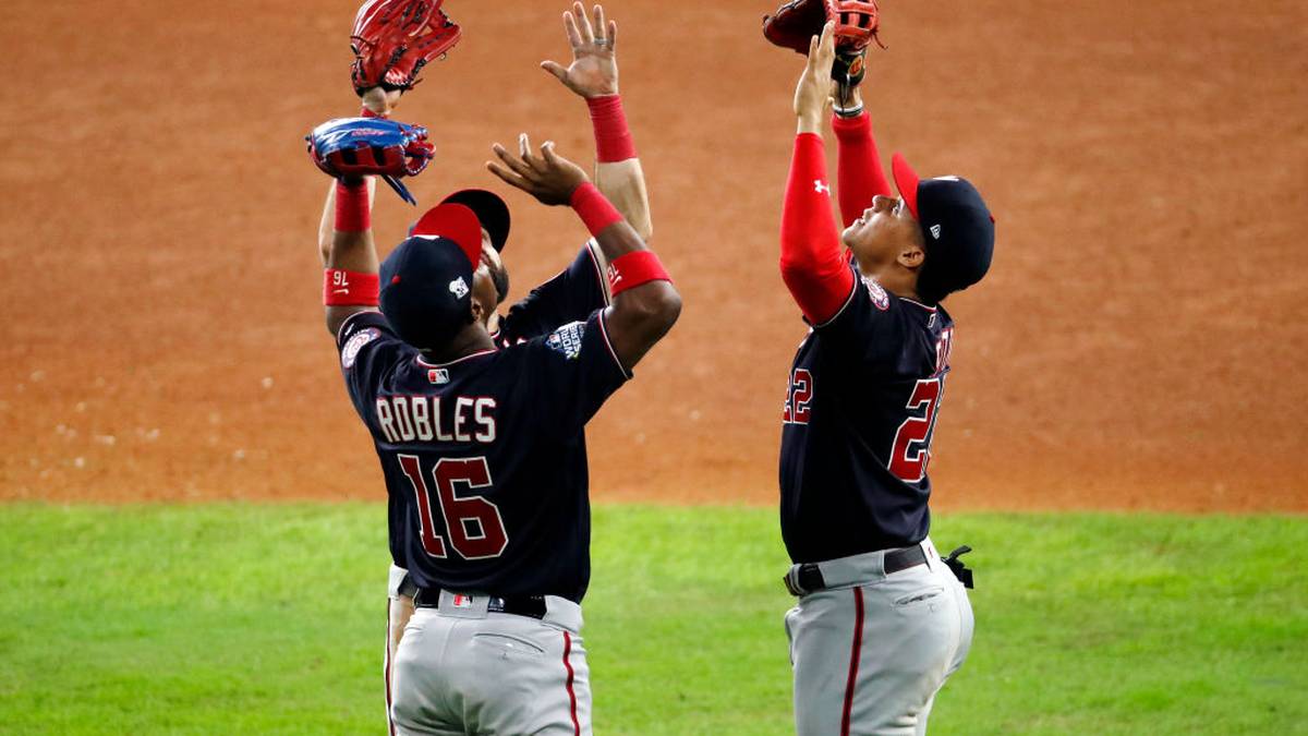 HOUSTON, TEXAS - OCTOBER 29:  Victor Robles #16, Adam Eaton #2 and Juan Soto #22 of the Washington Nationals celebrate their teams 7-2 win against the Houston Astros in Game Six of the 2019 World Series at Minute Maid Park on October 29, 2019 in Houston, Texas. (Photo by Tim Warner/Getty Images)