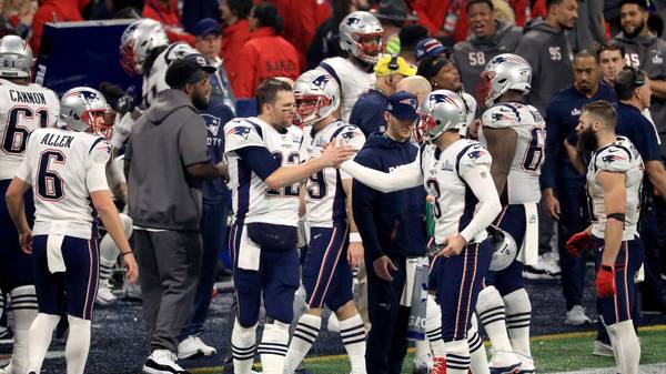 ATLANTA, GA - FEBRUARY 03: Tom Brady #12 of the New England Patriots high-fives Stephen Gostkowski #3 of the New England Patriots after Gostkowski made a field goal in the fourth quarter during Super Bowl LIII against the Los Angeles Rams at Mercedes-Benz Stadium on February 3, 2019 in Atlanta, Georgia.  (Photo by Mike Ehrmann/Getty Images)