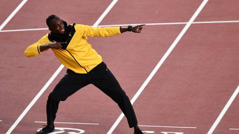 Da geht's lang: Beim Großen Preis der USA darf Usain Bolt die Fahrer auf die Piste schicken