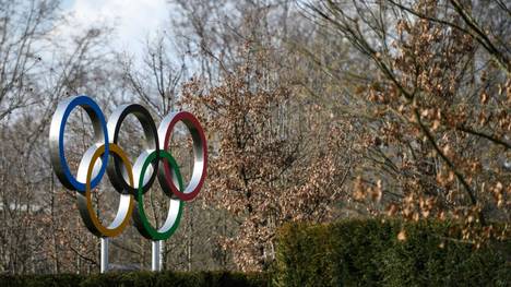 The Olympic Rings are pictured next to the headquarters of the International Olympic Committee (IOC) in Lausanne on March 21, 2020, as doubts increase over whether Tokyo can safely host the summer Games amid the spread of the COVID-19. - The global sporting calendar has been swept away by the coronavirus pandemic but the International Olympic Committee has insisted the Tokyo Games will go ahead in four months despite growing calls for a postponement. (Photo by Fabrice COFFRINI / AFP) (Photo by FABRICE COFFRINI/AFP via Getty Images)