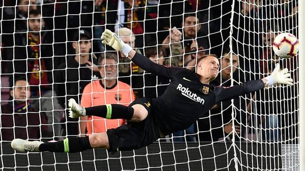Barcelona's German goalkeeper Marc-Andre Ter Stegen dives for the ball during the Spanish league football match between FC Barcelona and Real Sociedad at the Camp Nou stadium in Barcelona on April 20, 2019. (Photo by PAU BARRENA / AFP)        (Photo credit should read PAU BARRENA/AFP/Getty Images)