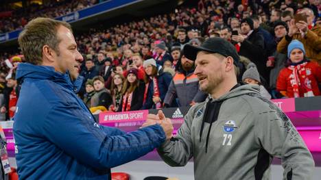 Bayern Munich's German head coach Hansi Flick (L) greats Paderborn's German head coach Steffen Baumgart as he arrives for the German first division Bundesliga football match FC Bayern Munich v SC Paderborn in Munich, southern Germany, on February 21, 2020. (Photo by Guenter SCHIFFMANN / AFP) / RESTRICTIONS: DFL REGULATIONS PROHIBIT ANY USE OF PHOTOGRAPHS AS IMAGE SEQUENCES AND/OR QUASI-VIDEO (Photo by GUENTER SCHIFFMANN/AFP via Getty Images)