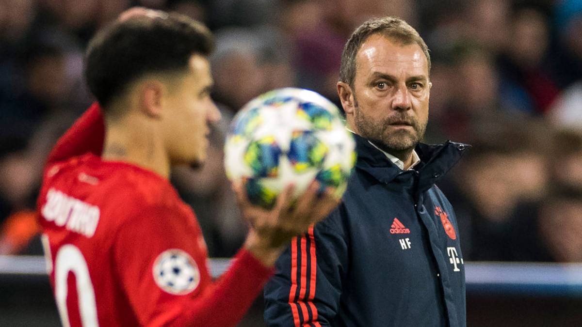 (FILES) In this file photo taken on December 11, 2019 Bayern Munich's German interim head coach Hans-Dieter Flick (R) watches Bayern Munich's Brazilian midfielder Philippe Coutinho preparing for a throw in during the UEFA Champions League Group B football match between Bayern Munich v Tottenham FC  in Munich, southern Germany. - Bayern Munich head coach Hansi Flick said he is willing to grant Philippe Coutinho time to rediscover his best form after finding himself relegated to the bench behind Thomas Mueller in recent weeks. (Photo by Odd ANDERSEN / AFP) / ALTERNATIVE CROP (Photo by ODD ANDERSEN/AFP via Getty Images)