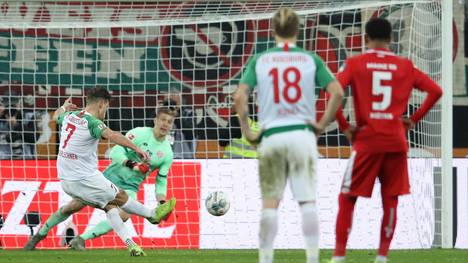 AUGSBURG, GERMANY - DECEMBER 07: Florian Niederlechner of FC Augsburg scores his team's second goal from the penalty spot during the Bundesliga match between FC Augsburg and 1. FSV Mainz 05 at WWK-Arena on December 07, 2019 in Augsburg, Germany. (Photo by Alexander Hassenstein/Bongarts/Getty Images)