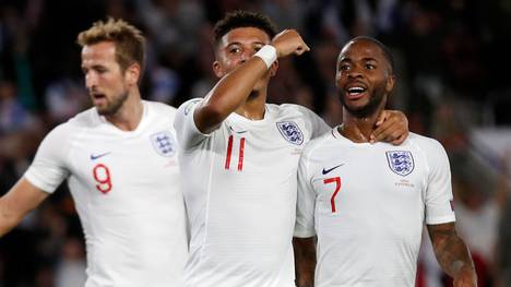 England's midfielder Jadon Sancho (C) celebrates with England's midfielder Raheem Sterling (R) after scoring his second, and the team's fifth goal during the UEFA Euro 2020 qualifying Group A football match between England and Kosovo at St Mary's stadium in Southampton, southern England on September 10, 2019. (Photo by Adrian DENNIS / AFP) / NOT FOR MARKETING OR ADVERTISING USE / RESTRICTED TO EDITORIAL USE        (Photo credit should read ADRIAN DENNIS/AFP/Getty Images)