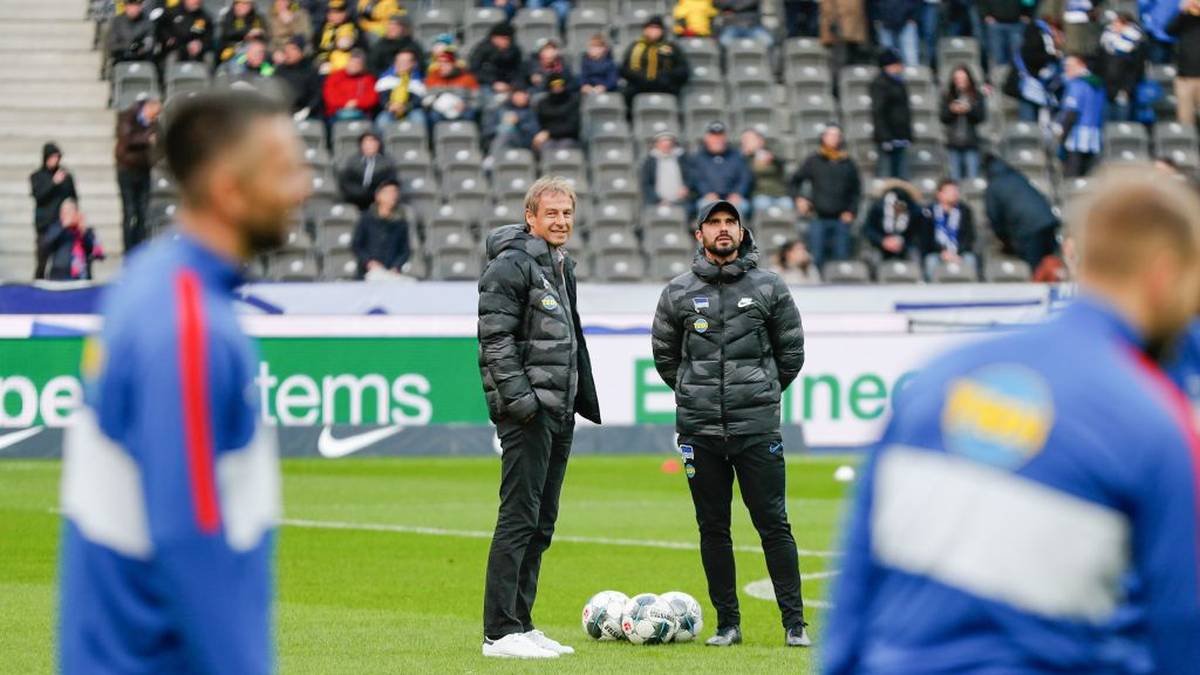 Hertha Berlin's German head coach Jurgen Klinsmann (L) and Hertha Berlin's assistant coach Alexander Nouri stand on the field prior the German first division Bundesliga football match Hertha Berlin v Borussia Dortmund in Berlin, Germany on November 30, 2019. (Photo by Odd ANDERSEN / AFP) / RESTRICTIONS: DFL REGULATIONS PROHIBIT ANY USE OF PHOTOGRAPHS AS IMAGE SEQUENCES AND/OR QUASI-VIDEO (Photo by ODD ANDERSEN/AFP via Getty Images)