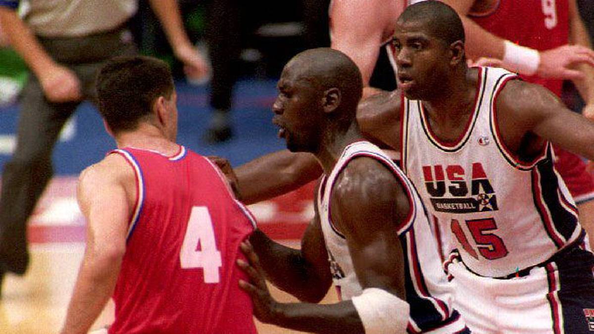 Croatian Drazen Petrovic (L) is guarded by U.S. Michael Jordan