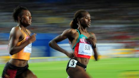 (L/R) Uganda's Annet Negesa and Kenya's Eunice Jepkoech Sum compete in the women's 800 metres semi-finals at the International Association of Athletics Federations (IAAF) World Championships in Daegu on September 2, 2011.   AFP PHOTO / MARK RALSTON (Photo credit should read MARK RALSTON/AFP via Getty Images)