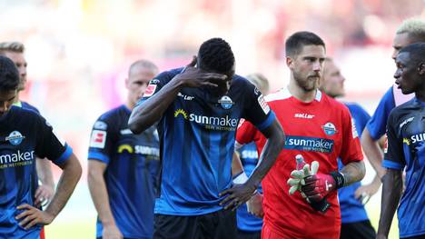 PADERBORN, GERMANY - AUGUST 24: SC Paderborn 07 side cuts a dejected figures after losing during the Bundesliga match between SC Paderborn 07 and Sport-Club Freiburg at Benteler Arena on August 24, 2019 in Paderborn, Germany. (Photo by Christof Koepsel/Bongarts/Getty Images)
