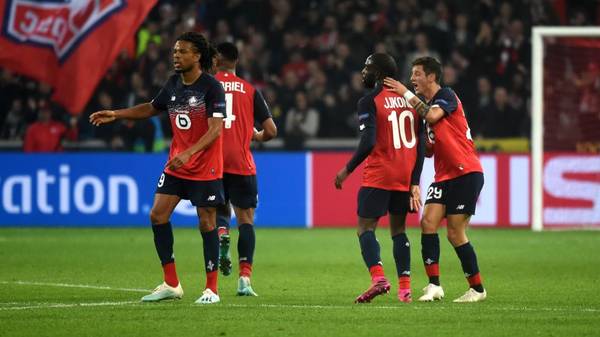 Lille's French forward Jonathan Ikone (2R) celebrates with team mates after scoring a goal during the UEFA Champions League Group H football match between Lille OSC (LOSC) and Valencia CF at the Stade Pierre-Mauroy in Villeneuve-d'Ascq, near Lille, on October 23, 2019. (Photo by FRANCOIS LO PRESTI / AFP) (Photo by FRANCOIS LO PRESTI/AFP via Getty Images)