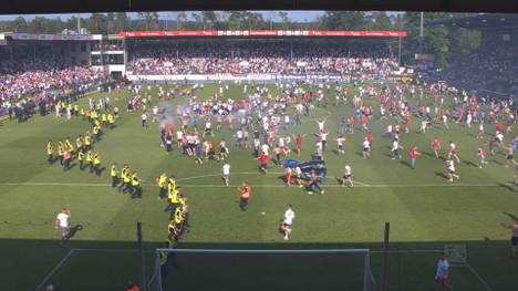 Hamburg fährt einen knappen Sieg in Sandhausen ein und glaubt sich in der Bundesliga. Doch der Platzsturm kommt zu früh und endet im Drama.