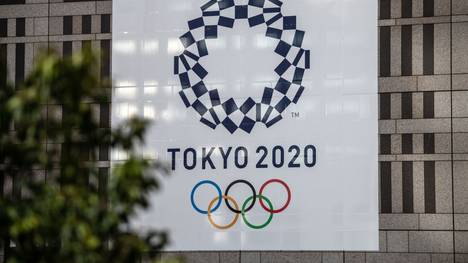 TOKYO, JAPAN - MARCH 19: A Tokyo 2020 Olympics banner is displayed on a building, on March 19, 2020 in Tokyo, Japan. As Japanese and IOC officials continued to insist that the Games would go ahead as planned, Japans Deputy Prime Minister said on Wednesday that the Tokyo Olympics are cursed, as speculation grows that the Olympics will have to be postponed due to the ongoing coronavirus (COVID-19) pandemic. (Photo by Carl Court/Getty Images)
