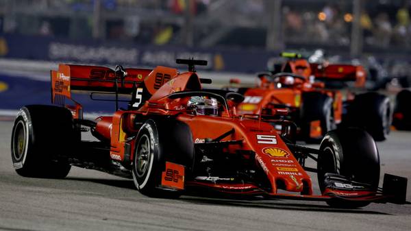 SINGAPORE, SINGAPORE - SEPTEMBER 22: Sebastian Vettel of Germany driving the (5) Scuderia Ferrari SF90 leads Charles Leclerc of Monaco driving the (16) Scuderia Ferrari SF90 on track during the F1 Grand Prix of Singapore at Marina Bay Street Circuit on September 22, 2019 in Singapore. (Photo by Charles Coates/Getty Images)