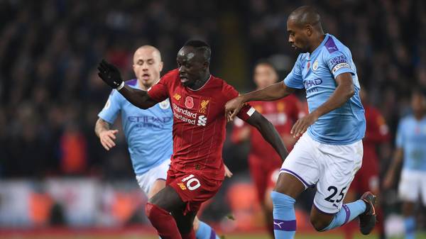 LIVERPOOL, ENGLAND - NOVEMBER 10: Sadio Mane of Liverpool battles for possession with Fernandinho of Manchester City during the Premier League match between Liverpool FC and Manchester City at Anfield on November 10, 2019 in Liverpool, United Kingdom. (Photo by Laurence Griffiths/Getty Images)