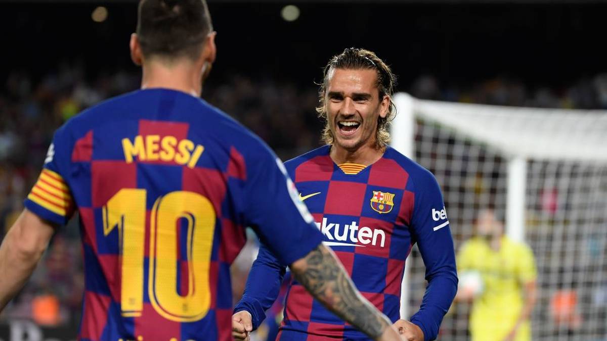 Barcelona's French forward Antoine Griezmann (R) is congratulated by teammate Barcelona's Argentine forward Lionel Messi after scoring the first goal during the Spanish league football match between FC Barcelona and Villarreal CF at the Camp Nou stadium in Barcelona, on September 24, 2019. (Photo by LLUIS GENE / AFP)        (Photo credit should read LLUIS GENE/AFP/Getty Images)