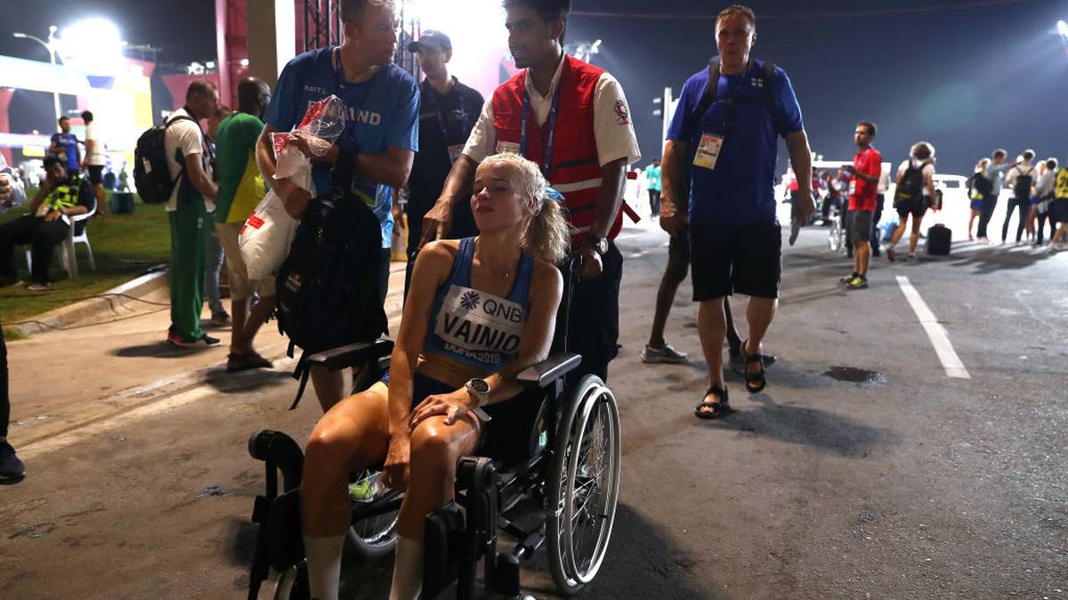 DOHA, QATAR - SEPTEMBER 27: Alisa Vainio of Finland is taken off on a wheelchair after the Women's Marathon on day one of 17th IAAF World Athletics Championships Doha 2019 at Khalifa International Stadium on September 27, 2019 in Doha, Qatar. (Photo by Alexander Hassenstein/Getty Images for IAAF)