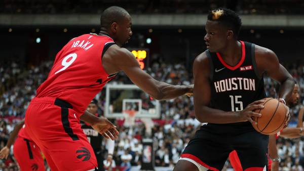 SAITAMA, JAPAN - OCTOBER 10: Clint Capela #15 of Houston Rockets handles the ball against Serge Ibaka #9 of Toronto Raptors during the preseason game between Toronto Raptors and Houston Rockets at Saitama Super Arena on October 10, 2019 in Saitama, Japan. NOTE TO USER: User expressly acknowledges and agrees that, by downloading and/or using this photograph, user is consenting to the terms and conditions of the Getty Images License Agreement. (Photo by Takashi Aoyama/Getty Images)