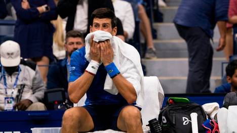Novak Djokovic of Serbia wipes his face with his towel while playing Stan Wawrinka of Switzerland during their Round Four Men's Singles match at the 2019 US Open at the USTA Billie Jean King National Tennis Center in New York on September 1, 2019. (Photo by Don Emmert / AFP)        (Photo credit should read DON EMMERT/AFP/Getty Images)