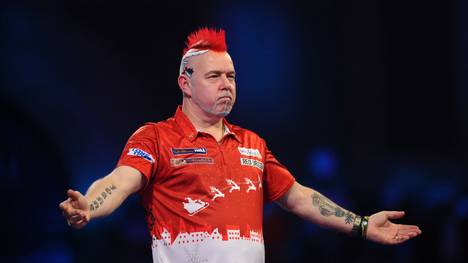 LONDON, ENGLAND - DECEMBER 23: Peter Wright of Scotland celebrates after winning his Third Round match against Seigo Asada of Japan during Day Eleven of the 2020 William Hill World Darts Championship at Alexandra Palace on December 23, 2019 in London, England. (Photo by Alex Burstow/Getty Images)