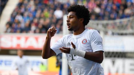 Munich's German forward Serge Gnabry celebrates scoring the 0-1 goal during the German first division Bundesliga football match SC Paderborn 07 v Bayern Munich in Paderborn, western Germany on September 28, 2019. (Photo by INA FASSBENDER / AFP) / DFL REGULATIONS PROHIBIT ANY USE OF PHOTOGRAPHS AS IMAGE SEQUENCES AND/OR QUASI-VIDEO        (Photo credit should read INA FASSBENDER/AFP/Getty Images)