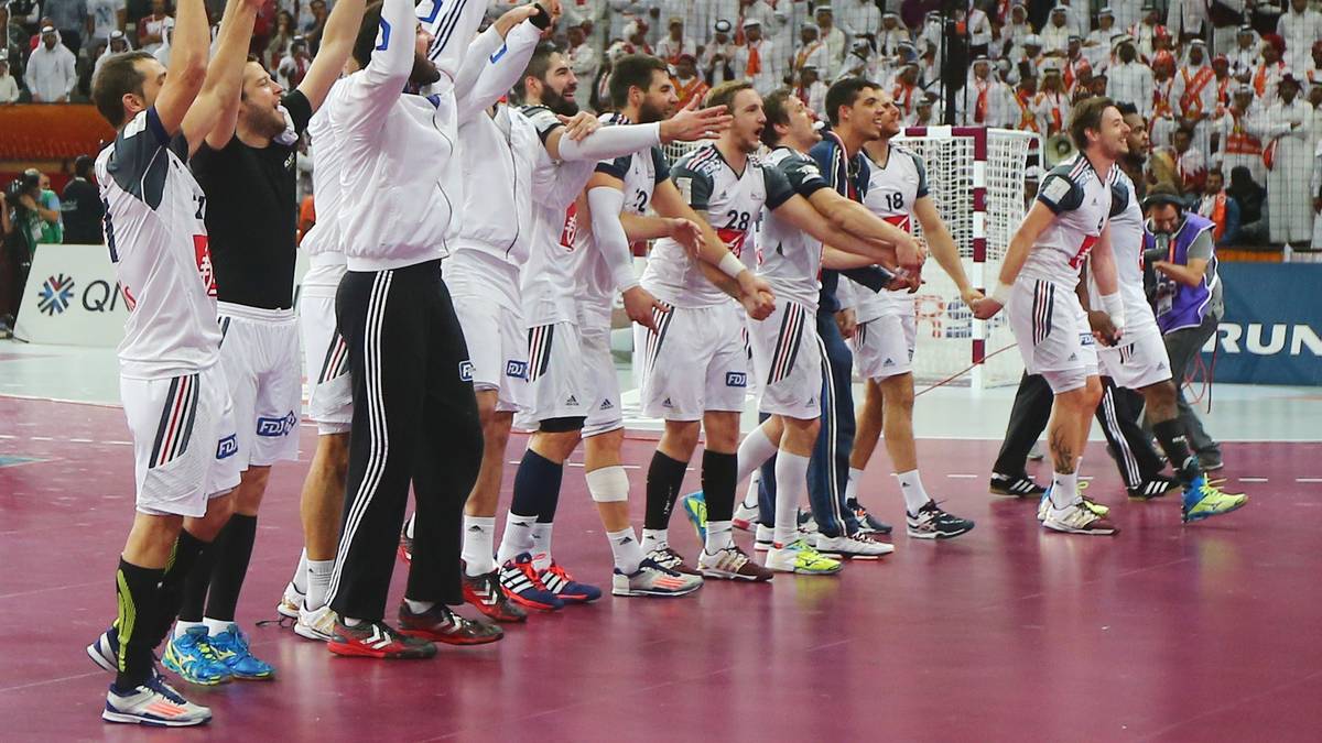 Players for France celebrate after the 24th Men's Handball World Championships final match between Qatar and France at the Lusail Multipurpose Hall in Doha on February 1, 2015. AFP PHOTO / MARWAN NAAMANI        (Photo credit should read MARWAN NAAMANI/AFP/Getty Images)