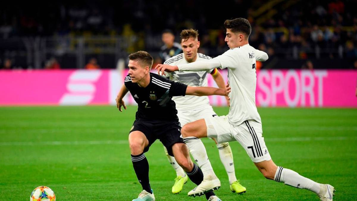 Argentina's Juan Foyth, Germany's midfielder Joshua Kimmich and Germany's midfielder Kai Havertz (L-R) vie for the ball during the friendly football match Germnay v Argentina in Dortmund, western Germany on October 9, 2019. (Photo by Ina FASSBENDER / AFP) (Photo by INA FASSBENDER/AFP via Getty Images)