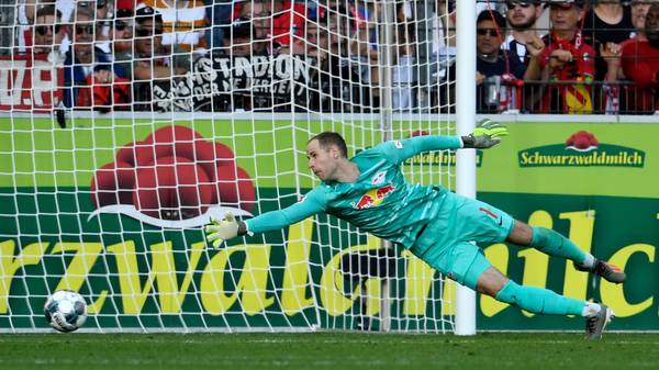 FREIBURG IM BREISGAU, GERMANY - OCTOBER 26: Peter Gulacsi of RB Leipzig fails to save as Nils Petersen of Sport-Club Freiburg (not pictured) scores Sport-Club Freiburg's second goal during the Bundesliga match between Sport-Club Freiburg and RB Leipzig at Schwarzwald-Stadion on October 26, 2019 in Freiburg im Breisgau, Germany. (Photo by Daniel Kopatsch/Bongarts/Getty Images)