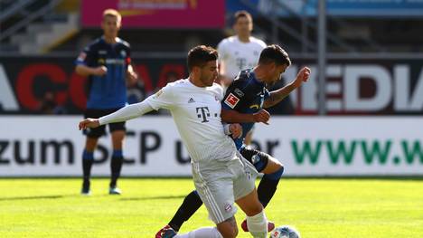 PADERBORN, GERMANY - SEPTEMBER 28: Lucas Hernandez of FC Bayern Munich battles for possession with Cauly Oliveira Souza of SC Paderborn 07 during the Bundesliga match between SC Paderborn 07 and FC Bayern Muenchen at Benteler Arena on September 28, 2019 in Paderborn, Germany. (Photo by Martin Rose/Bongarts/Getty Images)