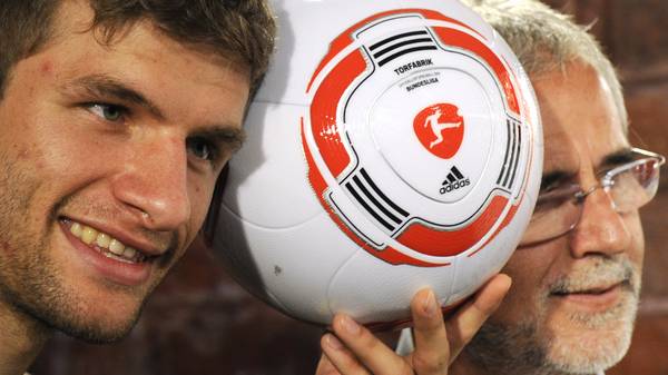 Germany's striker Thomas Mueller (L) and