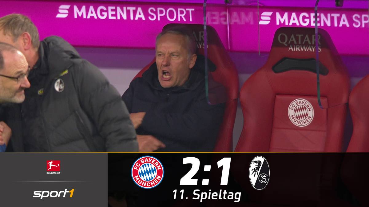 Der FC Bayern bezwingt den SC Freiburg im Top-Spiel. Leon Goretzka und Robert Lewandowski treffen zum Sieg. Einige Bayern-Fans fallen mit einem provokanten Plakat auf.