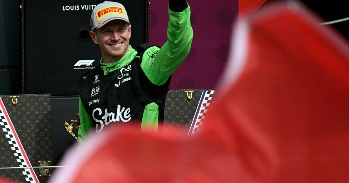Formula 1 racing imagery accompanying Audi's partnership news.