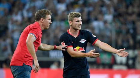 Leipzig's German headcoach Julian Nagelsmann and Leipzig's German forward Timo Werner (R) talk during the German first division Bundesliga football match Borussia Moenchengladbach v RB Leipzig in Moenchengladbach, western Germany on August 30, 2019. (Photo by Ina FASSBENDER / AFP) / RESTRICTIONS: DFL REGULATIONS PROHIBIT ANY USE OF PHOTOGRAPHS AS IMAGE SEQUENCES AND/OR QUASI-VIDEO        (Photo credit should read INA FASSBENDER/AFP via Getty Images)