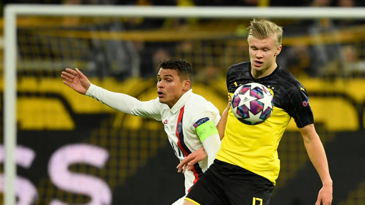 Dortmund's Norwegian forward Erling Braut Haaland (R) vies for the ball with Paris Saint-Germain's Brazilian defender Thiago Silva during the UEFA Champions League Last 16, first-leg football match BVB Borussia Dortmund v Paris Saint-Germain (PSG) in Dortmund, western Germany, on February 18, 2020. (Photo by Ina Fassbender / AFP) (Photo by INA FASSBENDER/AFP via Getty Images)