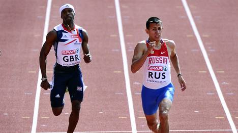 Maksim Dyldin of Russia (R) competes to