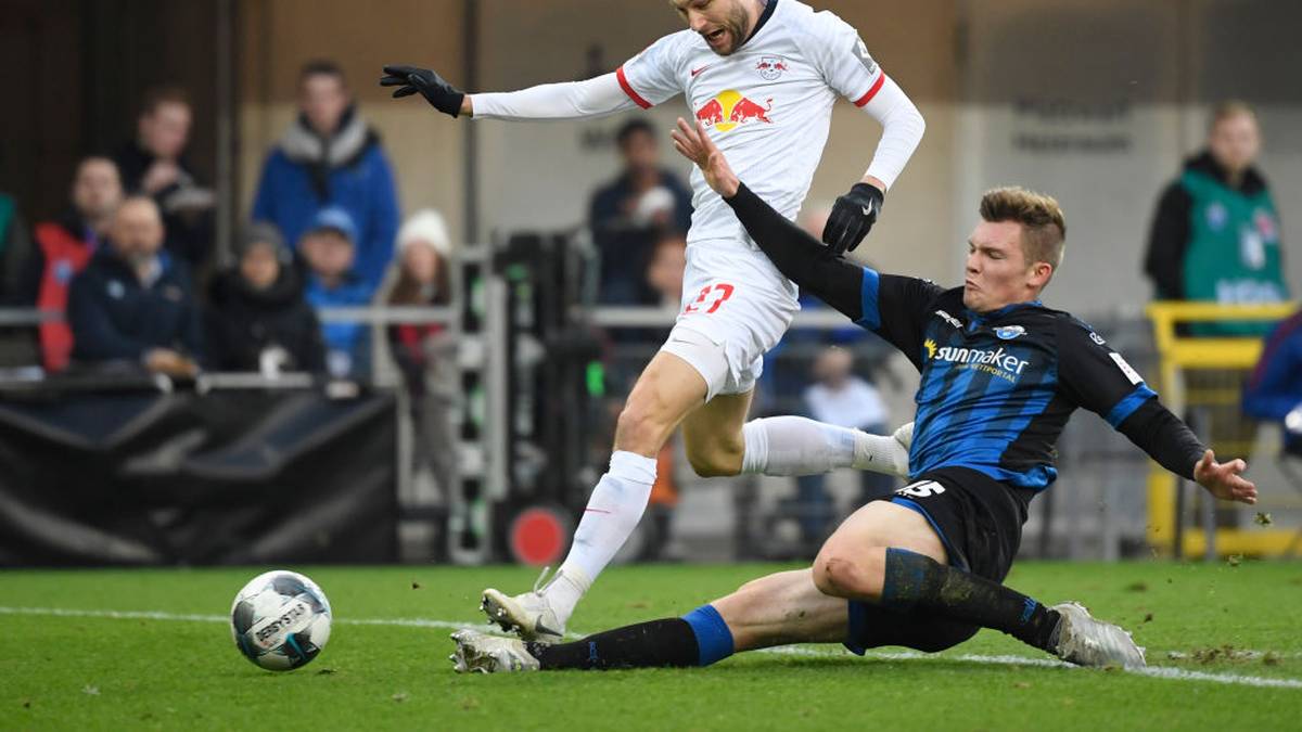 Leipzig's Austrian midfielder Konrad Laimer and Paderborn's German defender Luca Kilian vie for the ball during the German first division Bundesliga football match SC Paderborn 07 vs RB Leipzig in Padeborn, western Germany on November 30, 2019. (Photo by INA FASSBENDER / AFP) / RESTRICTIONS: DFL REGULATIONS PROHIBIT ANY USE OF PHOTOGRAPHS AS IMAGE SEQUENCES AND/OR QUASI-VIDEO (Photo by INA FASSBENDER/AFP via Getty Images)