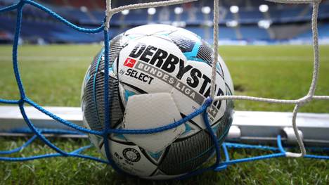 HAMBURG, GERMANY - MAY 24: A detailed view of a match ball in the goal net prior to the Second Bundesliga match between Hamburger SV and DSC Arminia Bielefeld at Volksparkstadion on May 24, 2020 in Hamburg, Germany. (Photo by Christian Charisius/Pool via Getty Images)