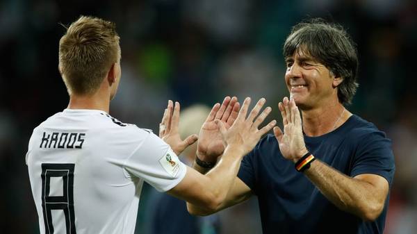 Germany's midfielder Toni Kroos (L) is congratulated by Germany's coach Joachim Loew (R) at the end of the Russia 2018 World Cup Group F football match between Germany and Sweden at the Fisht Stadium in Sochi on June 23, 2018. (Photo by Odd ANDERSEN / AFP) / RESTRICTED TO EDITORIAL USE - NO MOBILE PUSH ALERTS/DOWNLOADS        (Photo credit should read ODD ANDERSEN/AFP via Getty Images)