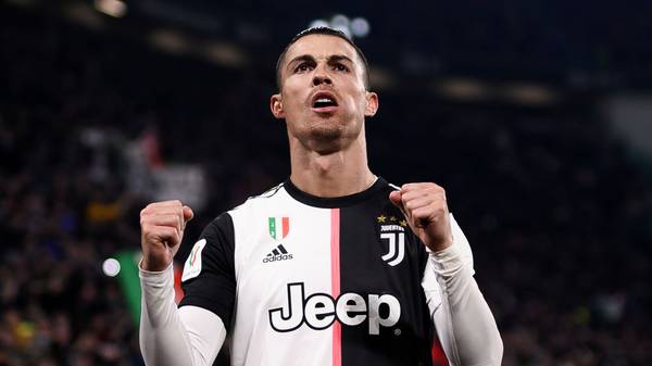 TOPSHOT - Juventus' Portuguese forward Cristiano Ronaldo celebrates after opening the scoring during the Italian Cup (Coppa Italia) round of 8 football match Juventus vs AS Roma on January 22, 2020 at the Juventus stadium in Turin. (Photo by Marco BERTORELLO / AFP) (Photo by MARCO BERTORELLO/AFP via Getty Images)